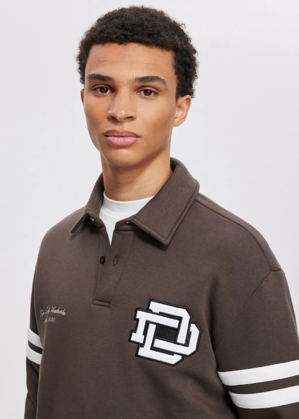 Polo's|Sweaters En Hoodies<The Sting Polo met logo bruin